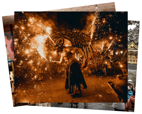 The figure of a winged devil surrounded by sparklers and fireworks