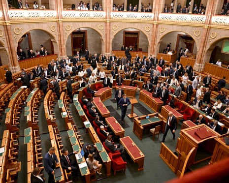 Members of the Hungarian Parliament leave the plenary hall to participate in a secret ballot to elect a new president at the parliament in Budapest, Hungary.