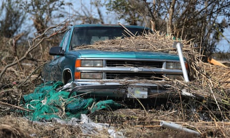 Debris covers a car in Cameron, Louisiana
