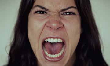 Young woman screaming, close-up<br>GettyImages-200069807-001