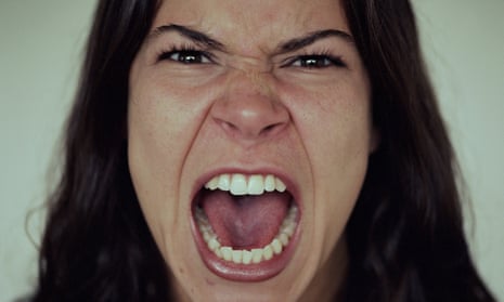 an up-close photo of a woman screaming