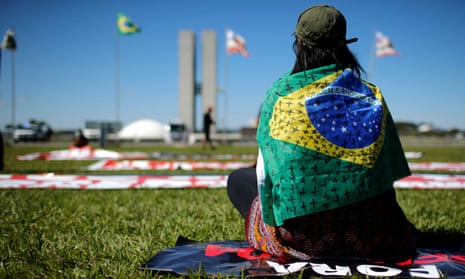 A demonstrator takes part in a protest against Brazil’s president Jair Bolsonaro in front of the National Congress in Brasilia, Brazil May 21, 2020. REUTERS/Adriano Machado