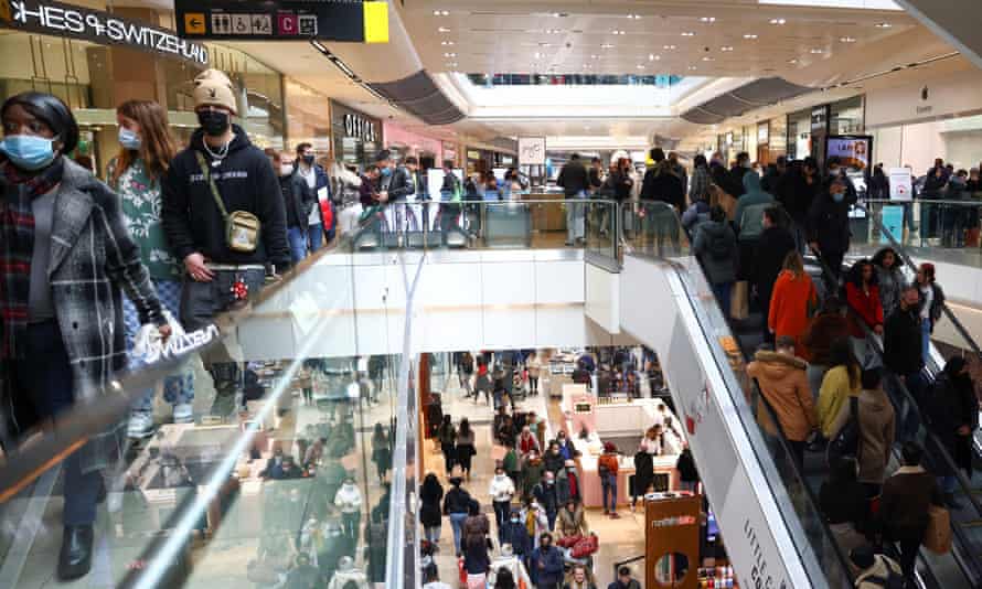 People walk through the Westfield Stratford City shopping centre.