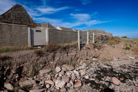 Clear signs of coastal erosion in Johnshaven with the path washed away up to the gates of houses.