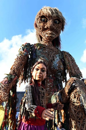 Storm (back), a 10-metre tall goddess of the sea puppet who carries a message of the oceans in crisis, meets Little Amal, a 3.5-metre tall 10-year-old Syrian refugee puppet