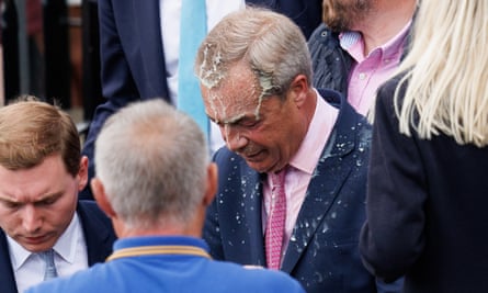 Milkshake drips down Nigel Farage’s head on to his suit