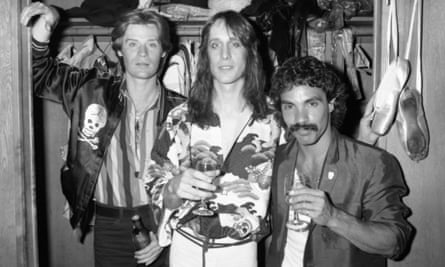 Rundgren (center) with Daryl Hall (left) and John Oates (right) in 1978, while recording his live album Back to the Bars, to which the duo contributed.