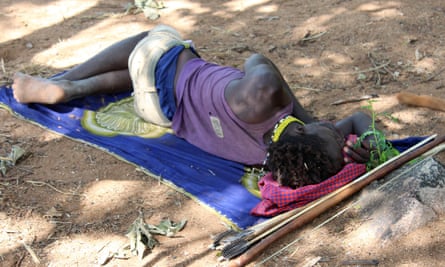 A Hadza man sleeps on an antelope skin in northern Tanzania.