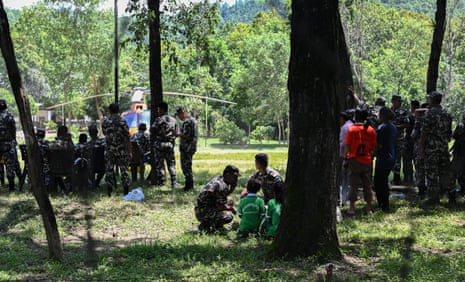 Rescued children are seen at an army rescue camp as search operations continue on August 27, 2026 in Trishuli Batar Nepal.
