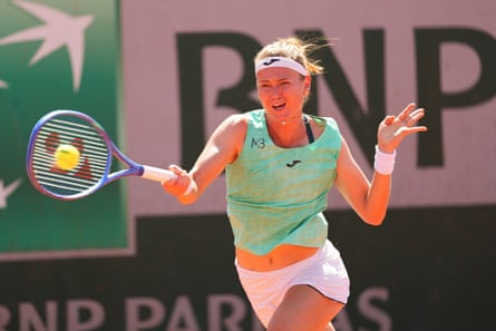 Marie Bouzkova hits a forehand against Fran Jones