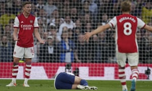 Arsenal's Rob Holding, left, reacts after receives a red card from referee during the English Premier League soccer match between Tottenham Hotspur and Arsenal at Tottenham Hotspur stadium in London, England, Thursday, May 12, 2022. (AP Photo/Matt Dunham)