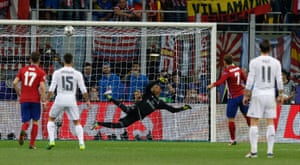 Navas watches the ball hit the bar.