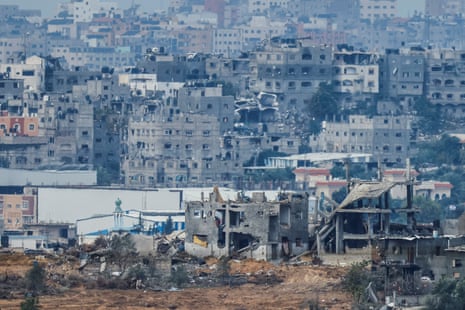 View of destroyed buildings in Gaza hit in Israeli strikes during the conflict, as seen from southern Israel.