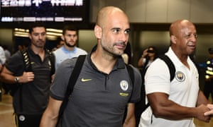 Manchester City manager Pep Guardiola arrives in Beijing