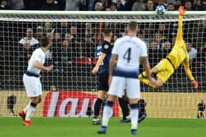 Tottenham Hotspur's Harry Winks sees this shot hit the bar.