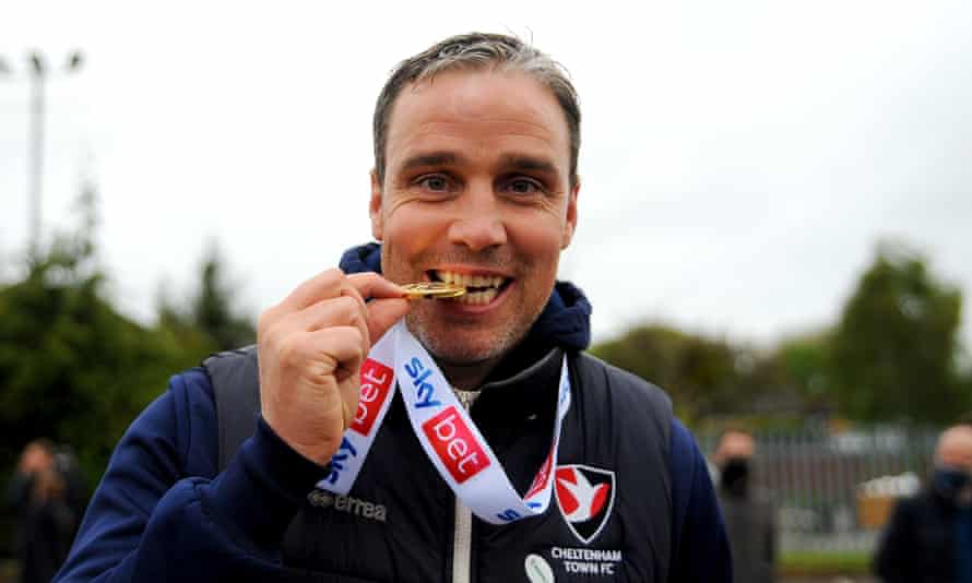 Michael Duff celebrates after Cheltenham won League Two in May 2021.