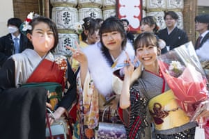 Three young women smile for the camera in Tokyo