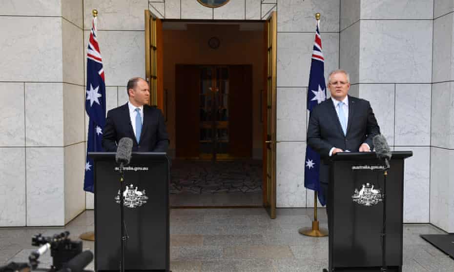The treasurer, Josh Frydenberg, and the prime minister, Scott Morrison, announce the government’s $130bn wage subsidy package at a press conference at Parliament House in Canberra.