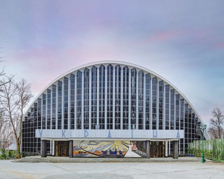 A domed building with a glass front