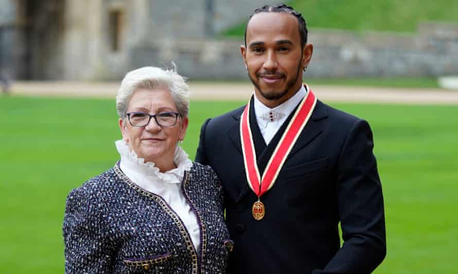 Sir Lewis Hamilton with his mother, Carmen Lockhart, after the F1 star was knighted at Windsor Castle.