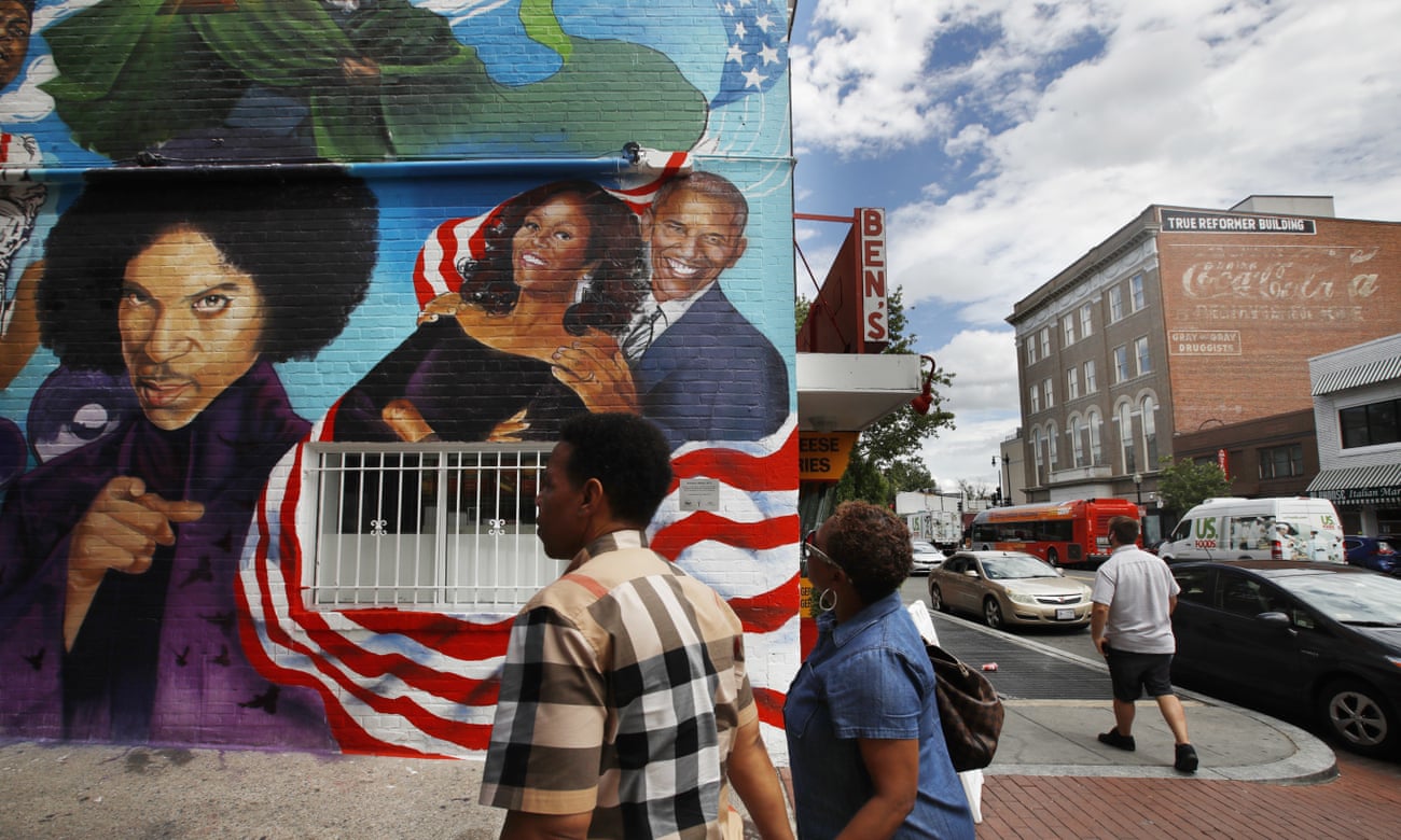 People visit the new mural at Ben’s Chili Bowl in Washington.