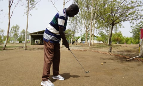 Gilbert Kaboré, who started as a caddy at Ouagadougou golf club at the age of six, plays one of the course’s holes