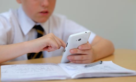 School pupil using a mobile phone