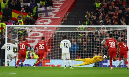 Caoimhin Kelleher saves Kylian Mbappé’s second-half penalty.
