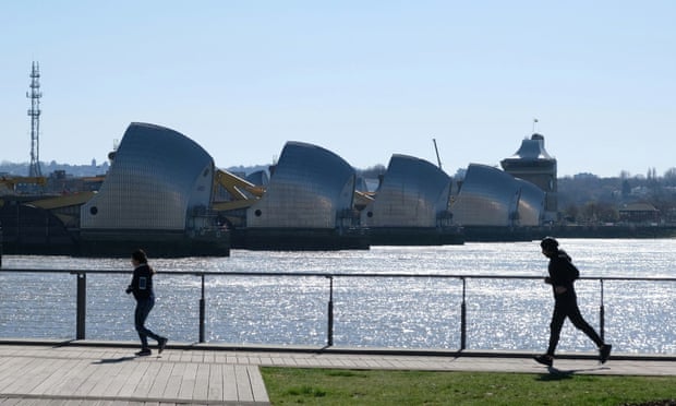 Joggers in Thames Barrier Park in Silvertown