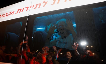 Aviva Siegel with her hands up on a coach window reacting to people outside