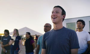 Facebook founder Mark Zuckerberg and his team watch the drone take flight.