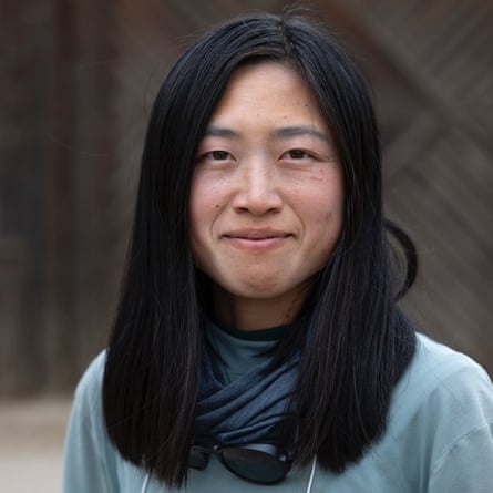 a woman looking at a camera