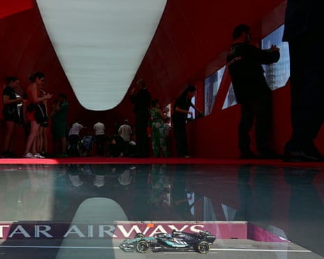 Spectators watch from a footbridge as Russell competes.