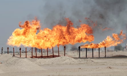 Flames emerge from a pipeline at Rumaila oilfield, Iraq.
