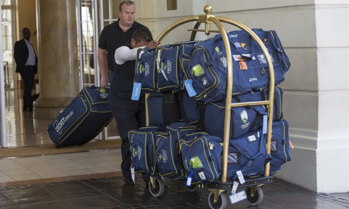 Luggage belonging to the Australia team is wheeled out of their hotel in Cape Town as the team prepare to depart.