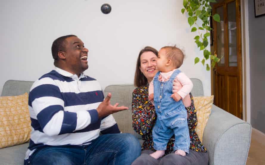 TravelGuides - ‘The fruit bowl is emptier and petrol is shocking’: one family’s experience of soaring cost of living | Inflation 4 Jon and Jess Daly with baby Robyn at home in Norwich, UK.