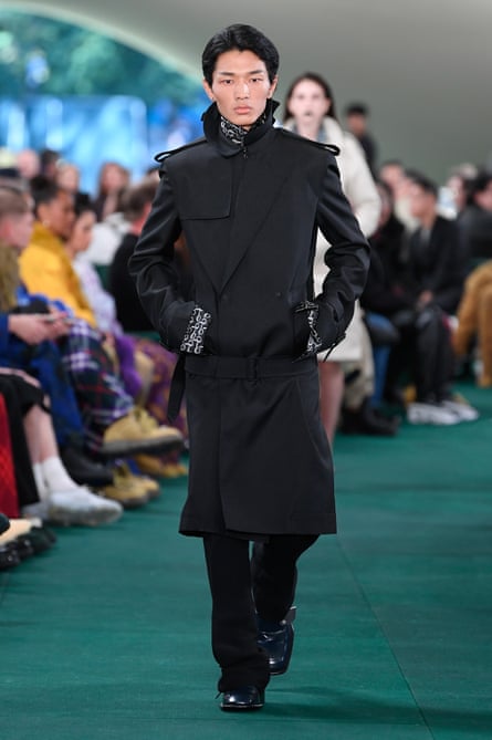 A model wears a Burberry trenchcoat.