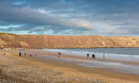 Fossil-rich cliffs leading to Filey Brigg, North Yorkshire.