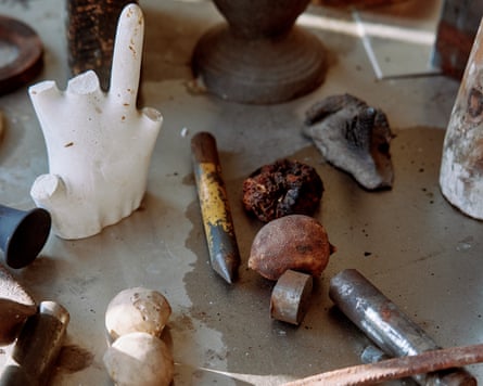 Tools and objects on a workbench.