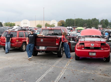 Ayden, Evan, Riley and Stevie stand with their trucks and cars at a car show