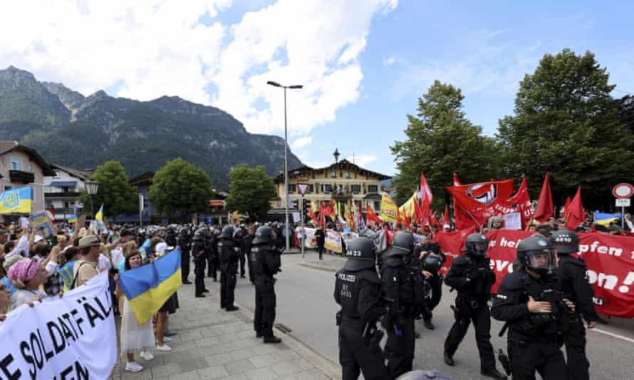 Protesters against the war in Ukraine war are separated from G7 protesters during a demonstration in Garmisch-Partenkirchen, Germany, on Sunday.