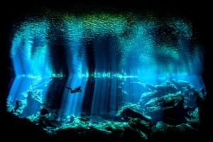 Out of the Blue by Nick Blake (UK)Underwater photographer of the year, British winnerKukulkan, one of the spectacular cenotes on Mexico’s Yucatán peninsula, is noted for its otherworldy light as sunbeams penetrate the darkness of the cave. Blake captured this diver in the centre of one of the beams.