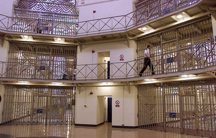 Interior walkways and corridors at Strangeways prison, with metal gates and railings on every level.