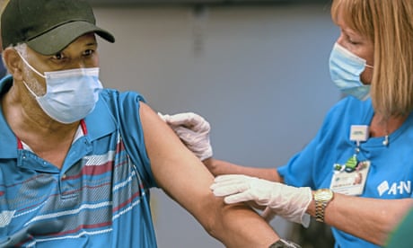 20210923smBooster05<br>Aurthur Sudduth prepares to receive a COVID-19 booster shot from registered nurse Darlene Klacik at Allegheny General Hospital on Pittsburgh's North Side on Thursday, Sept. 23, 2021. The U.S. vaccination drive against COVID-19 stood on the verge of a major new phase as government advisers Thursday recommended booster doses of Pfizer's vaccine for millions of older or otherwise vulnerable Americans — despite doubts the extra shots will do much to slow the pandemic. (Steve Mellon/Pittsburgh Post-Gazette via AP)