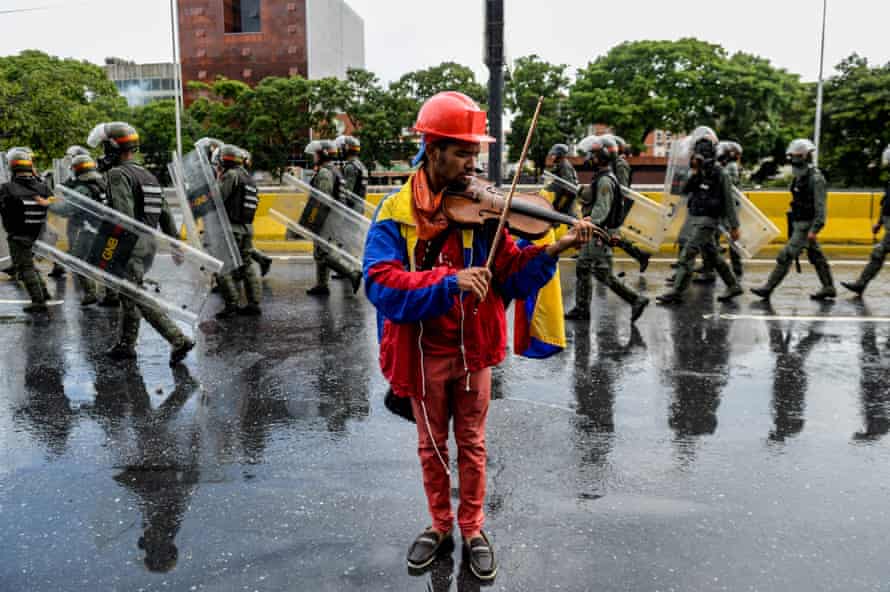 An opposition demonstrator plays the violin during a protest against President Nicolas Maduro in Caracas May 24, 2017.