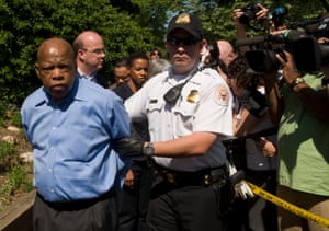 Lewis is arrested in April 2009, during a protest against the humanitarian crisis in Darfur outside the Sudanese Embassy in Washington.