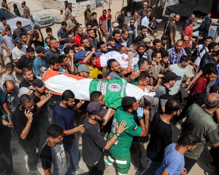 Mourners march with the bodies of journalists killed in an overnight Israeli strike on their tent outside a hospital in Gaza City