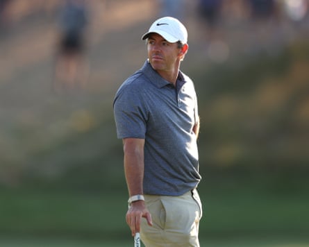 Rory McIlroy leans on his club