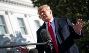 Donald Trump speaks to reporters on the South Lawn of the White House before boarding Marine One on Tuesday.