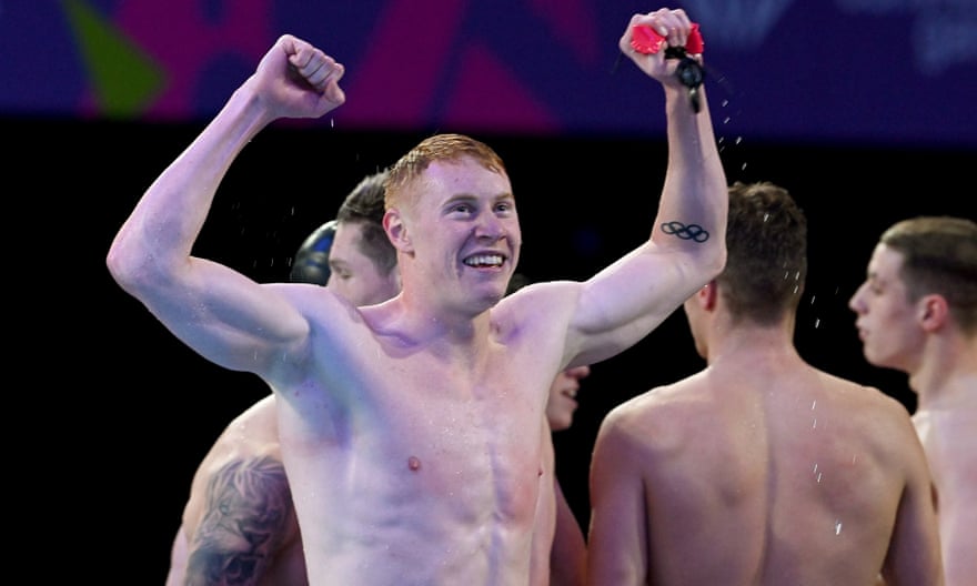 Tom Dean celebrates after winning the men's 4x100m medley final with England